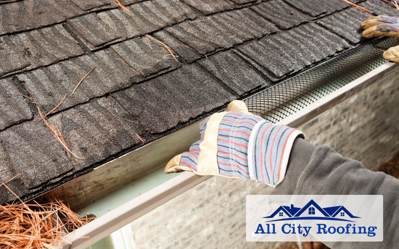 Regular gutter cleaning as part of shingle roofing maintenance.