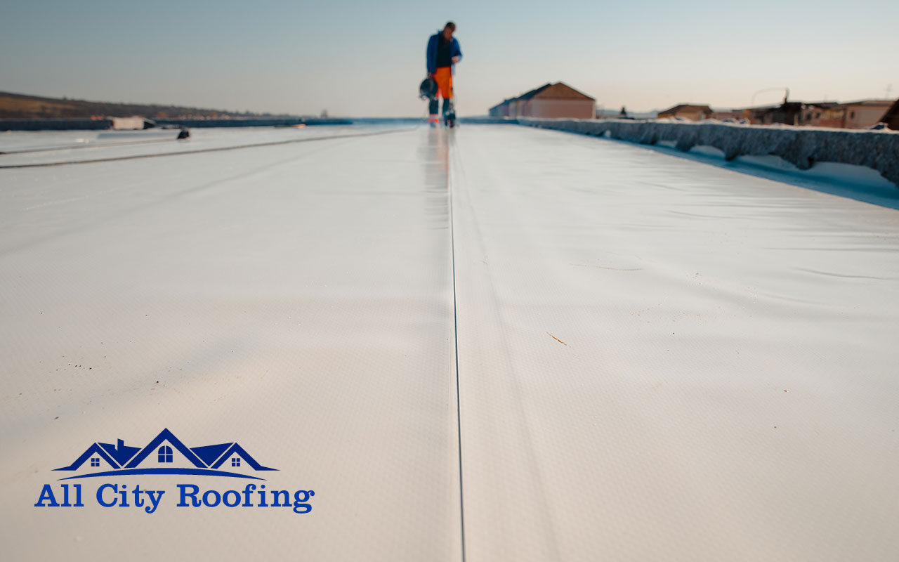 Cleaning a flat roof to prevent debris buildup and water pooling in Tri-Cities